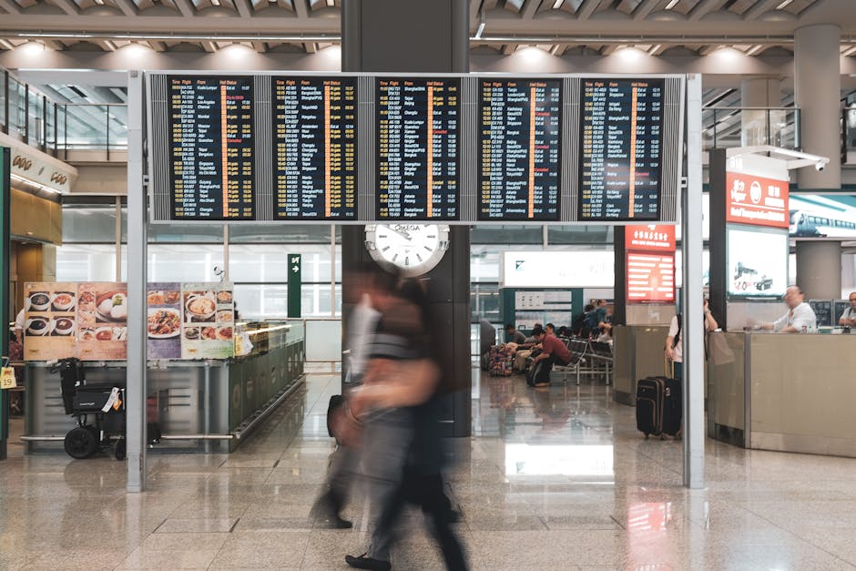 airport terminal with people rushing