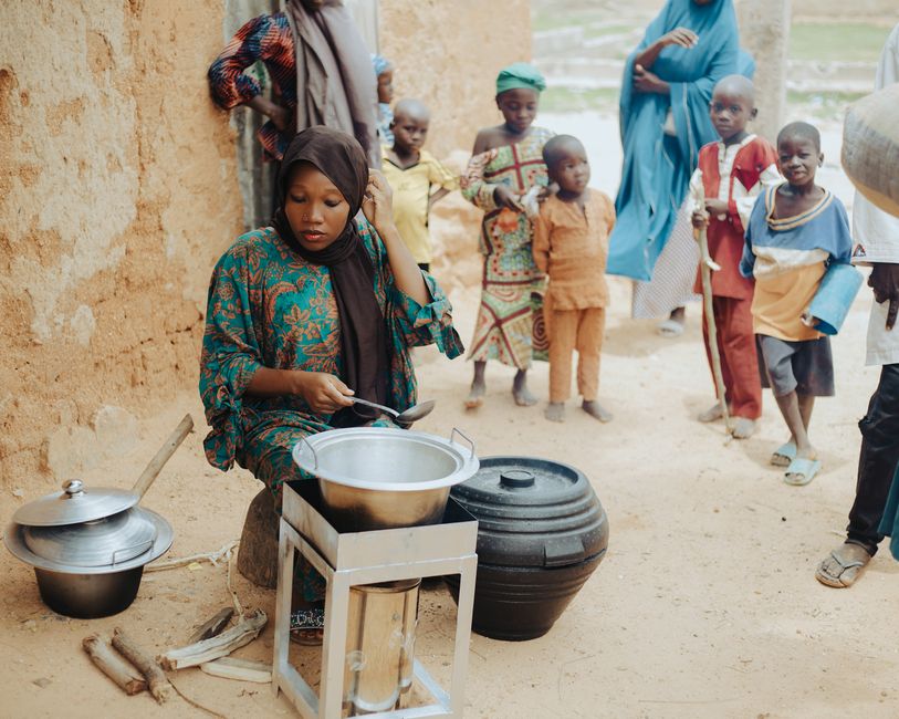 people engaged in cooking at home