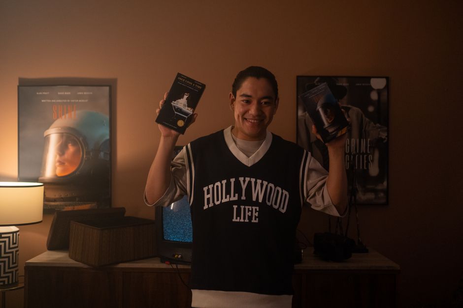 person looking at movie posters
