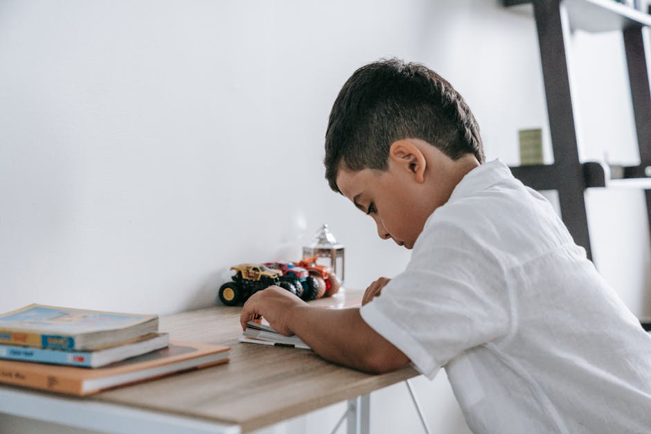 child studying at desk