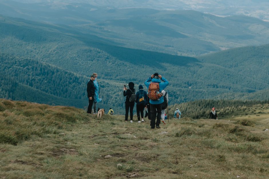 people engaged in mountain trekking