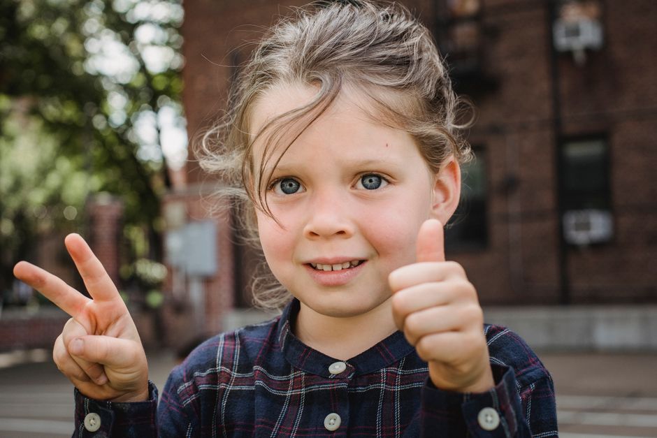 child showing seven fingers