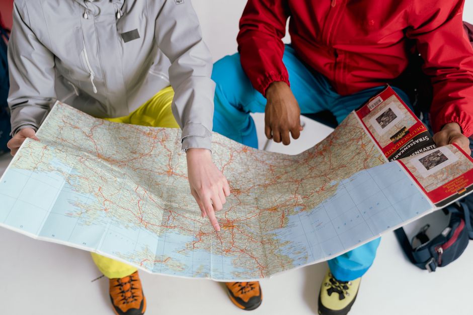 people engaged in road trip planning